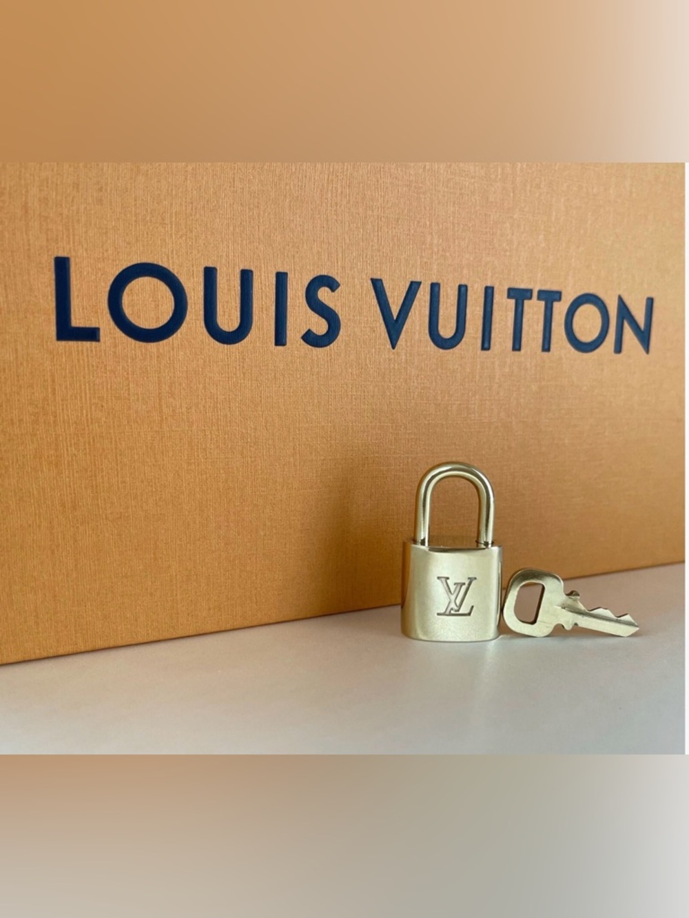 Louis Vuitton Gold Padlock with Matching Key can also be used as a necklace GWP